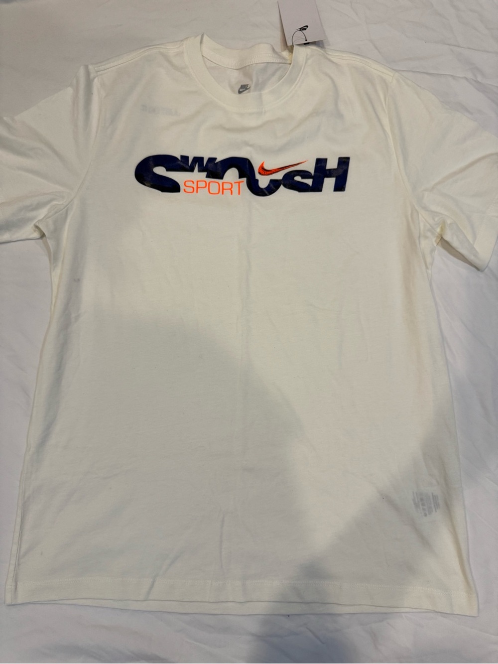 Nike White Tee with Navy SWOOSH and Orange Accent
